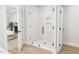 Modern shower with glass enclosure and hexagonal floor tiles at 2408 Adrift Road, Fuquay Varina, NC 27526