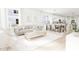 Open concept living and dining area with hardwood floors at 2408 Adrift Road, Fuquay Varina, NC 27526