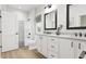 Modern bathroom with double vanity, bathtub, and shower at 2408 Adrift Road, Fuquay Varina, NC 27526