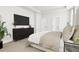 Spacious bedroom with a king-size bed, dresser, and large TV at 2408 Adrift Road, Fuquay Varina, NC 27526