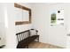 Inviting entryway with a bench and mirror, offering a welcoming feel at 2412 Adrift Road, Fuquay Varina, NC 27526