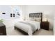 Bright bedroom with a double bed, nightstands, and large window at 2412 Adrift Road, Fuquay Varina, NC 27526
