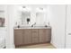 Double vanity bathroom with modern fixtures and spacious counters at 2412 Adrift Road, Fuquay Varina, NC 27526