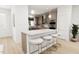 Open kitchen with island and breakfast bar, perfect for entertaining at 2412 Adrift Road, Fuquay Varina, NC 27526
