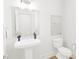 Clean and modern bathroom with pedestal sink and toilet at 2412 Adrift Road, Fuquay Varina, NC 27526