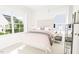 Bedroom with a double bed, nightstands, and window overlooking yard at 2412 Adrift Road, Fuquay Varina, NC 27526