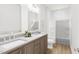 Modern bathroom with double vanity and bathtub at 2412 Adrift Road, Fuquay Varina, NC 27526