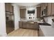Modern kitchen with stainless steel appliances and a farmhouse sink at 2412 Adrift Road, Fuquay Varina, NC 27526