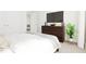 Bedroom with a double bed, dresser, and large TV at 2412 Adrift Road, Fuquay Varina, NC 27526