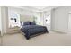 Comfortable main bedroom with a large bed and plenty of natural light at 2412 Adrift Road, Fuquay Varina, NC 27526
