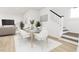 Modern dining room with seating for six near staircase and living room at 2412 Adrift Road, Fuquay Varina, NC 27526