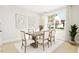 Charming dining room featuring a rustic table and soft lighting at 2419 Flagship Rd, Fuquay Varina, NC 27526