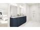 Elegant bathroom with double vanity, marble countertop, and large walk-in shower at 2404 Adrift Rd, Fuquay Varina, NC 27526