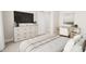 Well-lit bedroom featuring a desk and large bed at 2404 Adrift Rd, Fuquay Varina, NC 27526