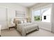Bright bedroom with a queen-size bed and large window at 2404 Adrift Rd, Fuquay Varina, NC 27526
