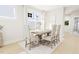 Bright dining room featuring a wood table and six chairs at 2404 Adrift Rd, Fuquay Varina, NC 27526