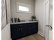 Stylish navy blue vanity with marble countertop at 2404 Adrift Rd, Fuquay Varina, NC 27526