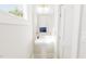 Small, clean bathroom with pedestal sink and simple decor at 2404 Adrift Rd, Fuquay Varina, NC 27526