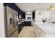 Modern kitchen with stainless steel appliances and dark blue cabinetry at 2404 Adrift Rd, Fuquay Varina, NC 27526