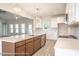 Modern kitchen with white cabinets, a large island, and stainless steel appliances at Tbd 1 Cedar Lane Rd, Sanford, NC 27332
