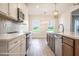 Bright kitchen with white cabinets, herringbone backsplash, and an island at Tbd 1 Cedar Lane Rd, Sanford, NC 27332