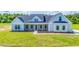 Modern farmhouse exterior with gray siding and landscaping at Tbd 1 Cedar Lane Rd, Sanford, NC 27332