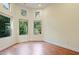 Bright bedroom featuring hardwood floors and multiple windows at 1217 Mauldin Cir, Wake Forest, NC 27587