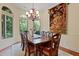 Formal dining room with large tapestry and chandelier at 1217 Mauldin Cir, Wake Forest, NC 27587