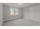 Secondary bedroom with lots of natural light and plush carpeting at 145 Leisure Ln, Louisburg, NC 27549