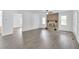 Living room featuring hardwood floors and a brick fireplace at 2171 Bud Lipscomb Rd, Willow Springs, NC 27592