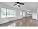 Spacious living room with hardwood floors and large windows at 2171 Bud Lipscomb Rd, Willow Springs, NC 27592