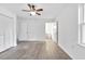 Bedroom featuring hardwood floors, ceiling fan and private bathroom access at 2171 Bud Lipscomb Rd, Willow Springs, NC 27592