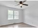 Well-lit bedroom with hardwood floors and a window at 2171 Bud Lipscomb Rd, Willow Springs, NC 27592