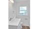 Simple bathroom with white vanity and fixtures at 2171 Bud Lipscomb Rd, Willow Springs, NC 27592