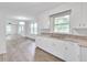 Open concept kitchen with white cabinets and granite countertops at 2171 Bud Lipscomb Rd, Willow Springs, NC 27592