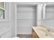 Bathroom with a vanity, linen closet, and mirror at 2171 Bud Lipscomb Rd, Willow Springs, NC 27592