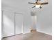 Bedroom with hardwood floors, ceiling fan, and sliding door closet at 2171 Bud Lipscomb Rd, Willow Springs, NC 27592