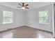 Simple bedroom with hardwood floors and ceiling fan at 2171 Bud Lipscomb Rd, Willow Springs, NC 27592