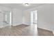 Bright dining room with hardwood floors and access to other rooms at 2171 Bud Lipscomb Rd, Willow Springs, NC 27592