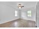 Well-lit bedroom with hardwood floors and ceiling fan at 2171 Bud Lipscomb Rd, Willow Springs, NC 27592