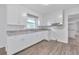 Renovated kitchen featuring white cabinets and granite countertops at 2171 Bud Lipscomb Rd, Willow Springs, NC 27592