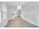 Bright dining room with wood-look floors and view to kitchen at 2171 Bud Lipscomb Rd, Willow Springs, NC 27592