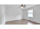 Bright bedroom with hardwood floors and a ceiling fan at 2171 Bud Lipscomb Rd, Willow Springs, NC 27592