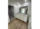 Double vanity bathroom with granite countertop and walk-in closet at 139 Grace Ridge Ct, Benson, NC 27504