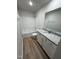 Simple bathroom with a single vanity, bathtub, and vinyl flooring at 139 Grace Ridge Ct, Benson, NC 27504