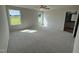 Bright and spacious bedroom with carpet flooring and large windows at 139 Grace Ridge Ct, Benson, NC 27504