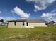 Newly built home with a grassy backyard and patio at 139 Grace Ridge Ct, Benson, NC 27504