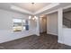 Bright dining room with hardwood floors and elegant chandelier at 324 Bishop Ln, Sanford, NC 27330