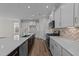 Bright kitchen features stainless steel appliances and a herringbone backsplash at 36 Railcar Way, Clayton, NC 27520