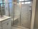 Luxurious shower with glass enclosure and built-in seat at 607 Hyperion Aly, Wake Forest, NC 27587